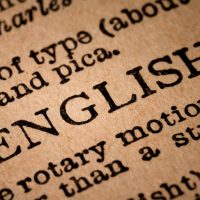 Close-up of an Opened Dictionary showing the Word ENGLISH October 1st, 2015 - Montreal, Canada. Close-up of an Old 1945 Webster Vintage Dictionary showing the Word ENGLISH